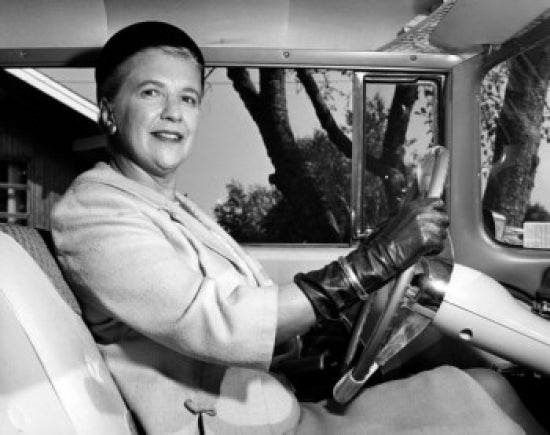 Portrait of a senior woman driving a car poster print.