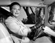 Portrait of a senior woman driving a car poster print.