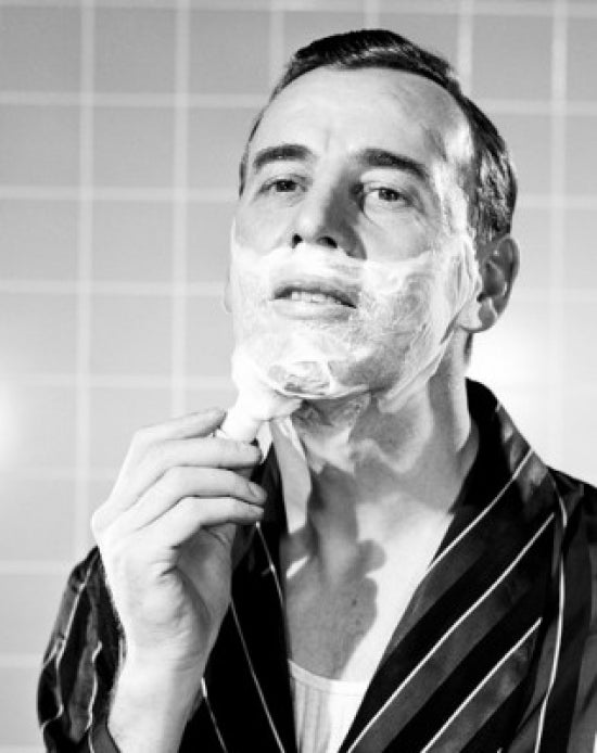 Man Shaving Poster Print showcasing a moment of grooming art.