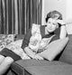 Housewife with Fatigued Expression Leaning on Sofa Poster Print