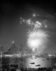 Fireworks exploding over a city skyline poster print