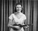 Portrait of Young Woman Playing Ukulele Poster Print