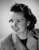 Close-up poster print of a young woman smiling, perfect for home or office decor.
