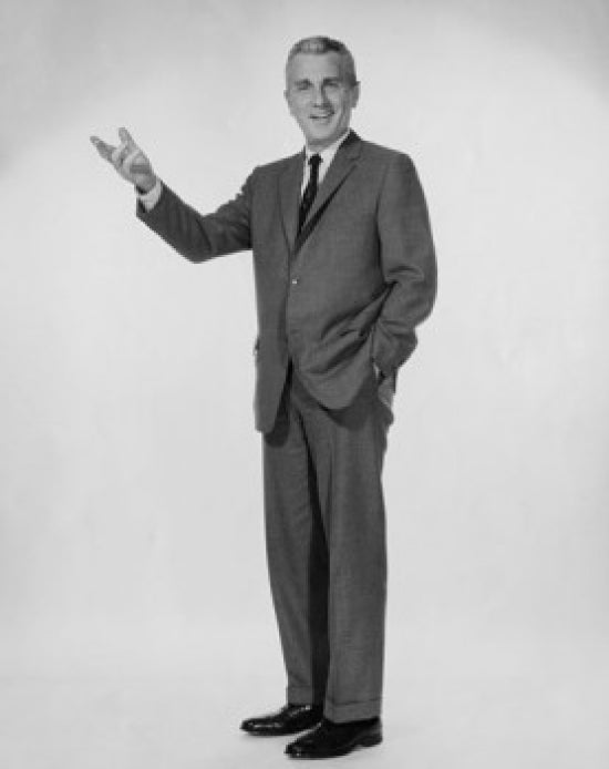 Portrait of businessman standing with hand in pocket poster print