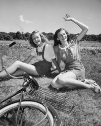 Poster Print of Two Teenage Girls Sitting on Grass and Smiling
