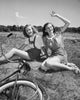 Poster Print of Two Teenage Girls Sitting on Grass and Smiling