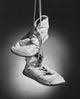 Close-Up of a Pair of Shoes Poster Print showcasing intricate shoe details.