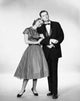 Young Couple Standing Together Poster Print on premium paper.