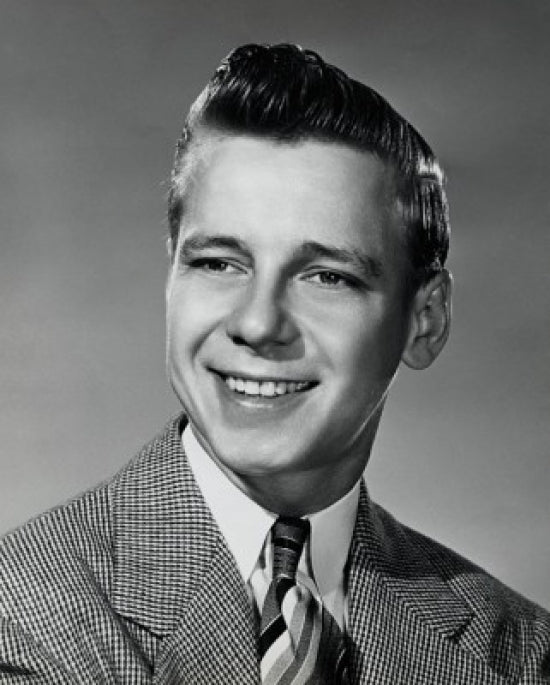 Close-up of a teenage boy smiling poster print showcasing joy and positivity.