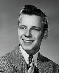 Close-up of a teenage boy smiling poster print showcasing joy and positivity.