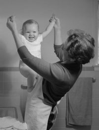 Mother Playing with Baby Girl in Bathroom Poster Print