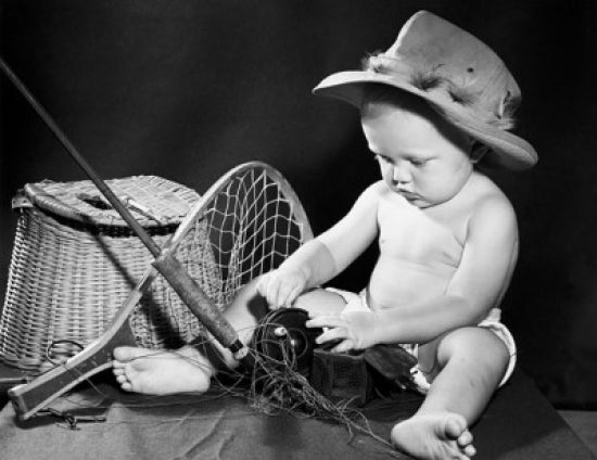 Close-up of a baby with fishing gear poster print