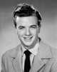 Studio portrait of teenage boy smiling poster print
