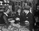 Poster print featuring a senior man and two mature women in an antique shop.