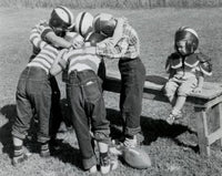 Boys in a Huddle Poster Print showcasing teamwork and sportsmanship.
