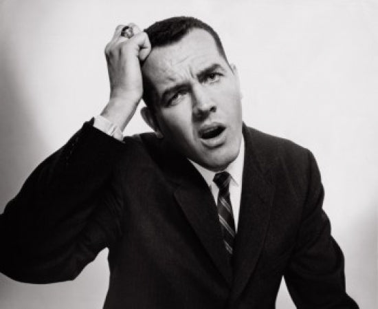 Close-up of a confused businessman poster print, perfect for office decor.