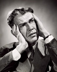 Close-up of a businessman suffering from a headache poster print.