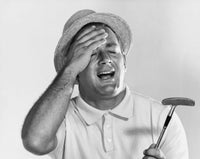 Close-up poster print of a mid adult man holding a golf club.