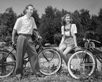 Young Couple with Bicycles in Park Poster Print