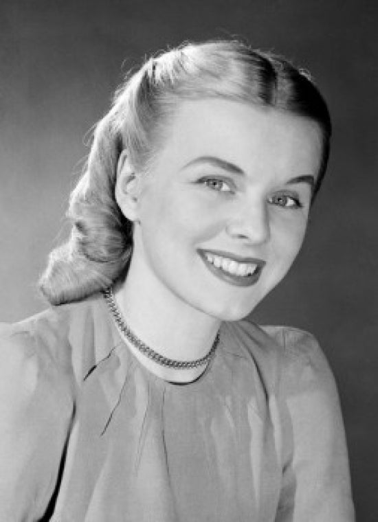 Studio portrait of a young woman smiling poster print