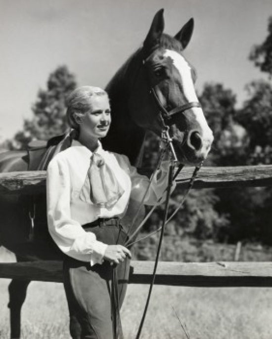 Young woman with horse on ranch poster print showcasing country life.