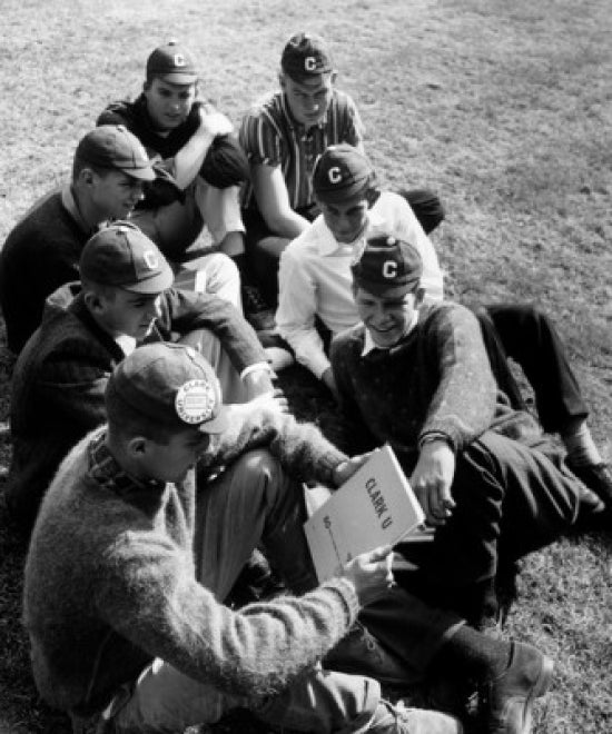 High angle view of young men sitting on a lawn poster print.