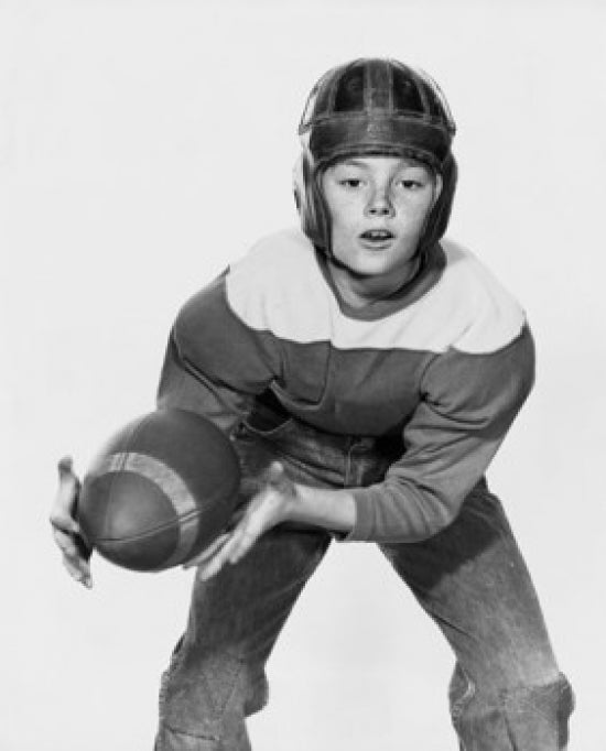 American football player catching football poster print