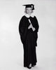 Young woman in graduation gown holding diploma poster print
