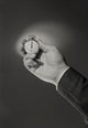 Businessman Holding Pocket Watch Poster Print showcasing elegance and sophistication.