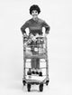 Portrait of a Young Woman Holding a Shopping Cart Poster Print