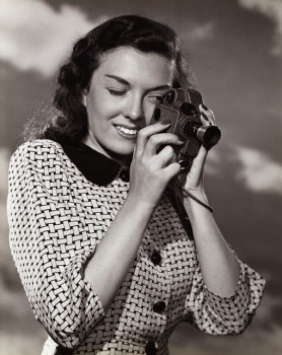 Young Woman Taking a Photograph Poster Print
