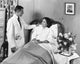 Poster print of a male doctor talking to a patient in side profile.