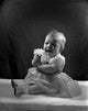 Portrait of Unhappy Baby Girl Poster Print featuring a charming child expression.