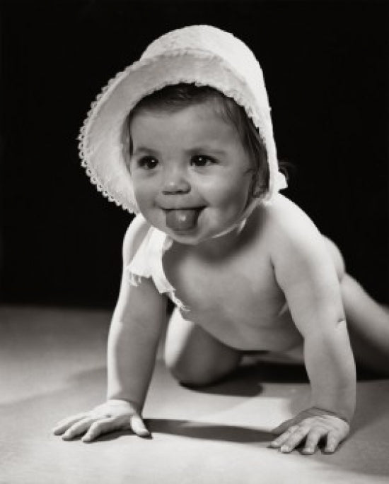 Close-up poster print of a crawling baby sticking out its tongue