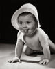Close-up poster print of a crawling baby sticking out its tongue