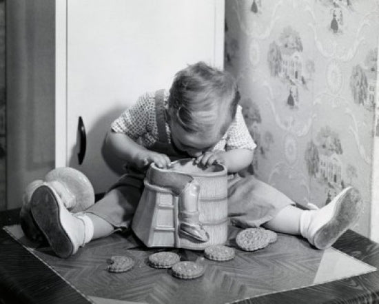 Close-Up of a Boy Looking into a Cookie Jar Poster Print
