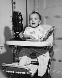 Baby Sitting in a High Chair Poster Print