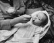 Mid section view of woman feeding daughter poster print