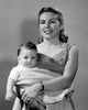 Portrait of a young mother holding her baby boy poster print