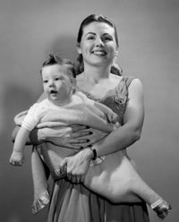 Portrait of young mother holding baby boy poster print