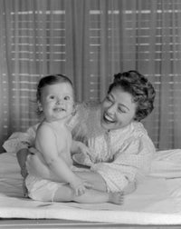 Young Woman Embracing Baby Girl Poster Print - Heartwarming family art