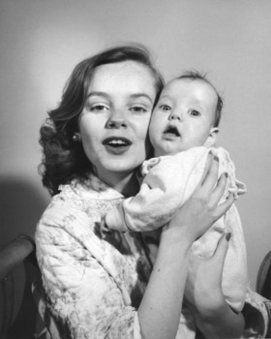 Portrait of mother and baby cheek to cheek poster print, showcasing a loving bond.