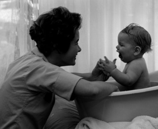 Mother Playing with Baby in Bathtub Poster Print