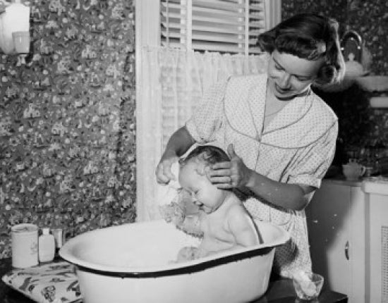 Art print of a young woman washing her son in a bathtub.