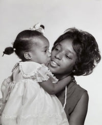 Daughter Kissing Her Mother Poster Print showcasing love and connection.