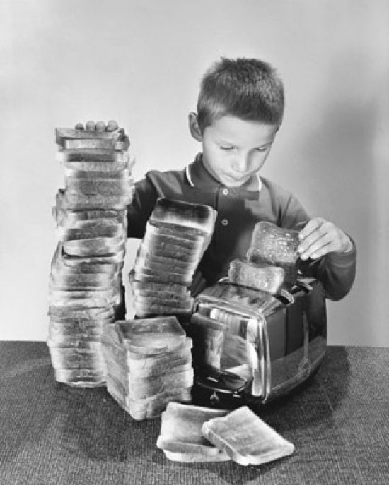 Boy Toasting Bread in a Toaster Poster Print