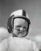 Boy wearing a safety helmet poster print, vibrant and engaging design.