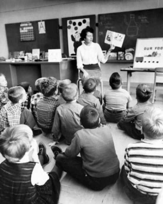 Inspiring Teacher in Classroom Poster Print
