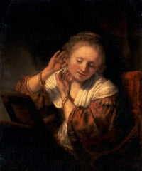 Young Woman Trying on Earrings Poster Print by Rembrandt Harmensz van Rijn