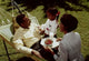 Family Bonding in Nature Poster Print featuring a couple and their daughter in a hammock.